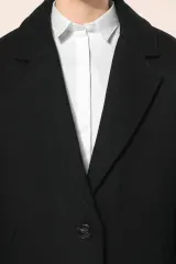 Abrigo muejer