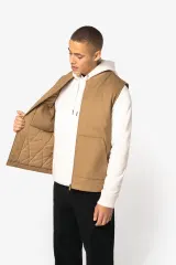 Chaleco acolchado de sarga ecorresponsable con cuello tipo beisbolera unisex