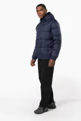 Chaqueta ripstop reciclada con capucha unisex